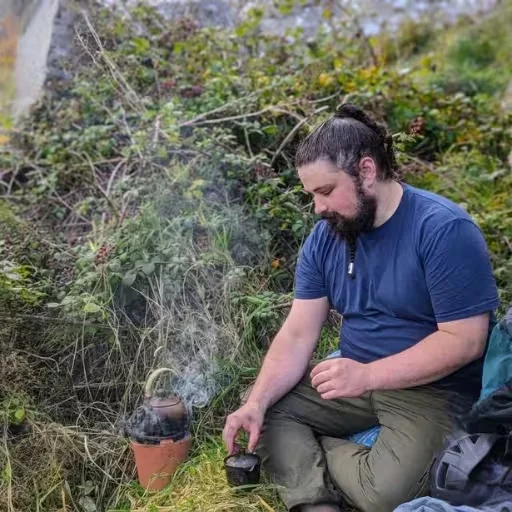 Duncan Davis brewing tea outdoors on the North Coast